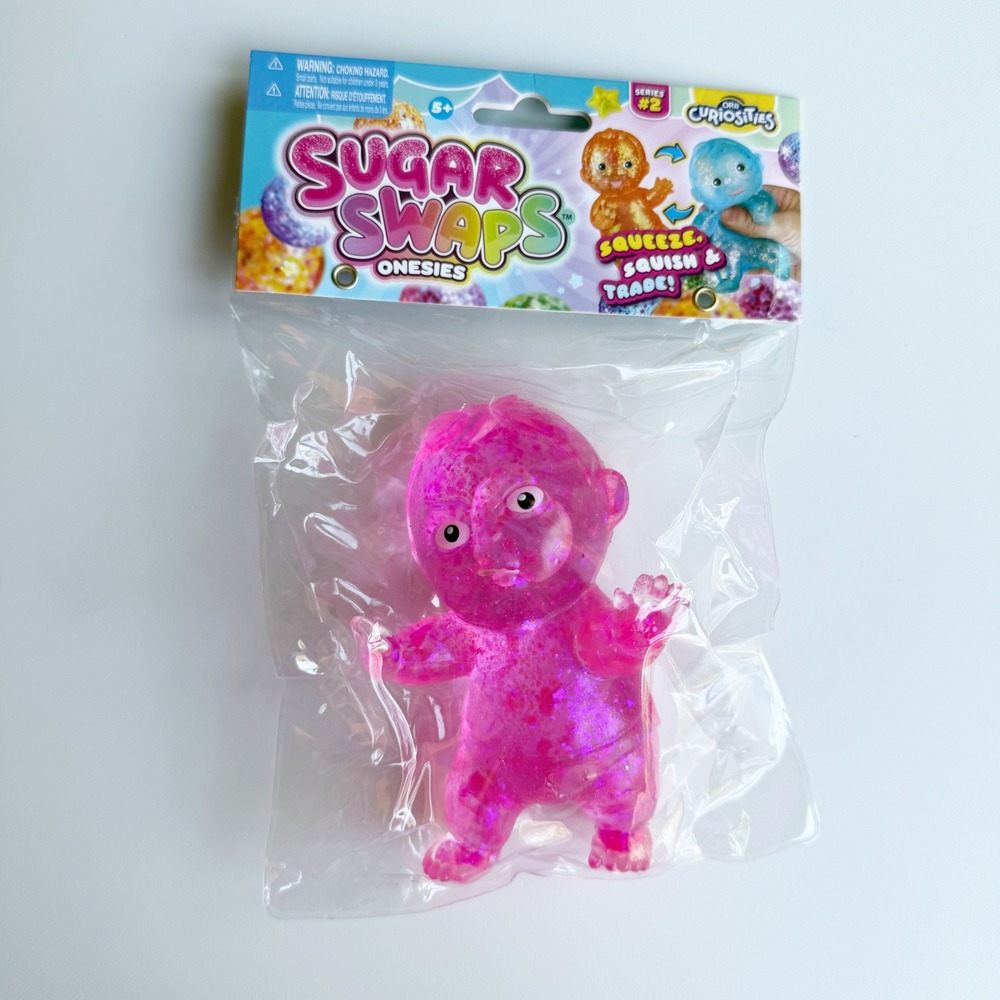 NEW Orb Curiosities Sugar Swaps Onesies Series 2 Pink Glitter Squishy Baby